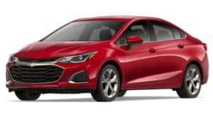 A red 2019 Chevy Cruze is facing left.