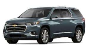A blue 2019 Chevy Traverse is facing left.