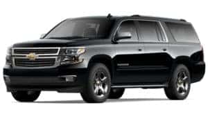 A black 2020 Chevy Suburban is facing left.
