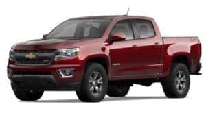 A red 2020 Chevy Colorado is facing left.
