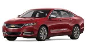 A red 2020 Chevy Impala is facing left.