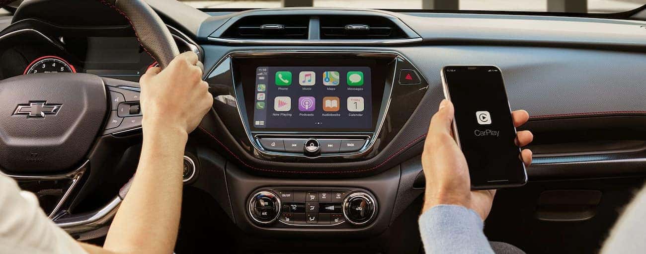 The dashboard and infotainment features like Apple CarPlay are shown on a 2021 Chevy Trailblazer.