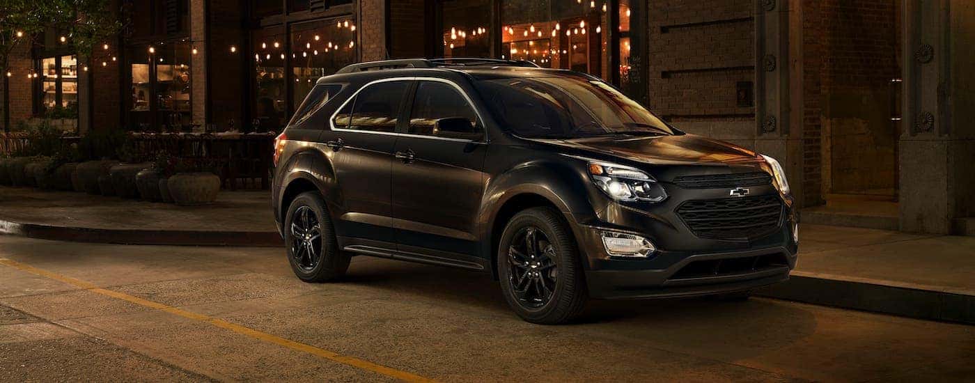 A black 2020 Chevy Equinox Midnight Edition is parked on a Bethlehem, PA, street at night.