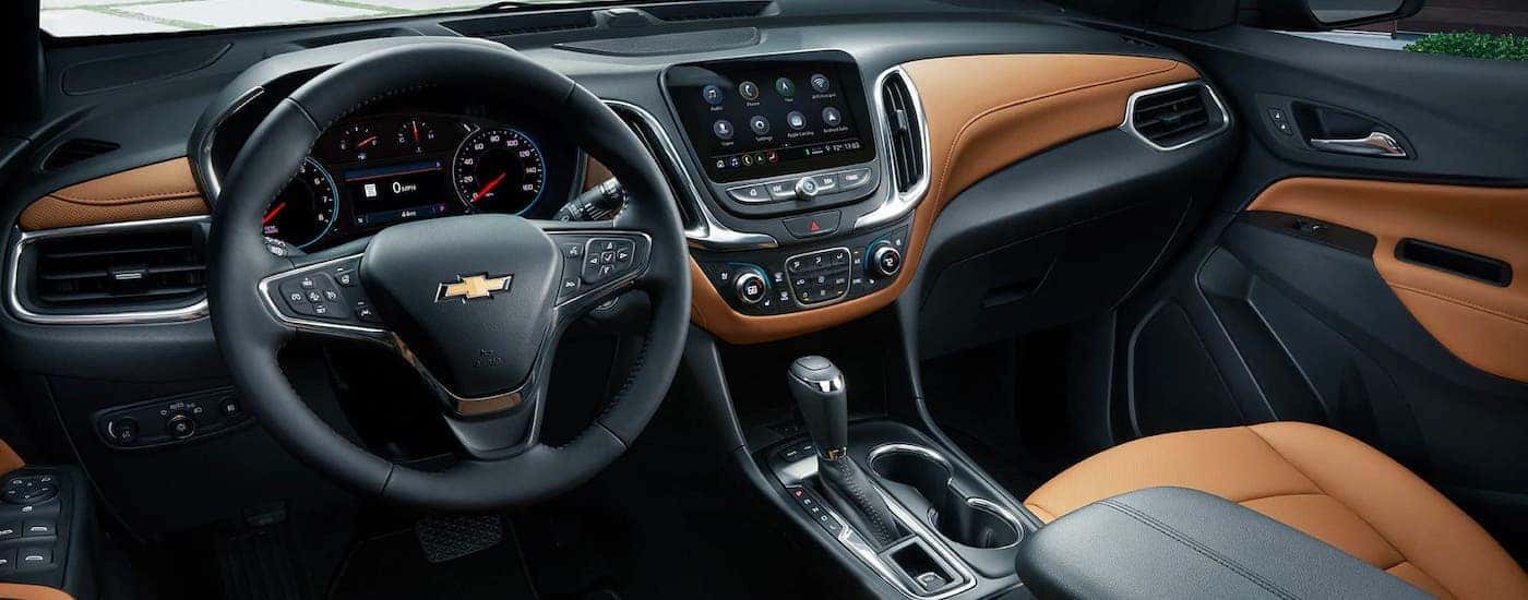 The brown and black interior if a 2020 Chevy Equinox is shown.