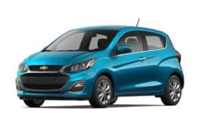 A blue 2021 Chevy Spark is angled left.