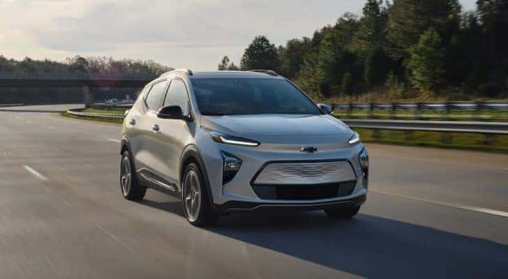 A silver 2022 Chevy Bolt EUV is driving on a highway after leaving a Pennsylvania electric car dealer.