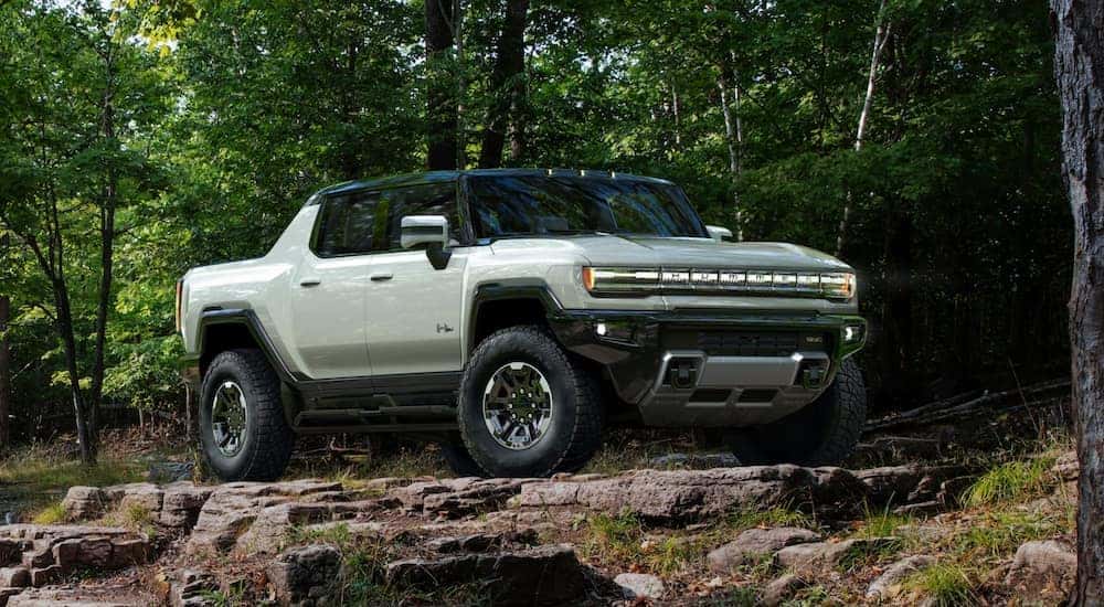 A white 2020 Hummer EV is off-roading.