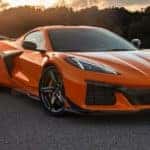 An orange 2022 Corvette Z06 is shown parked outside of a Chevy dealer in Nazareth, PA.