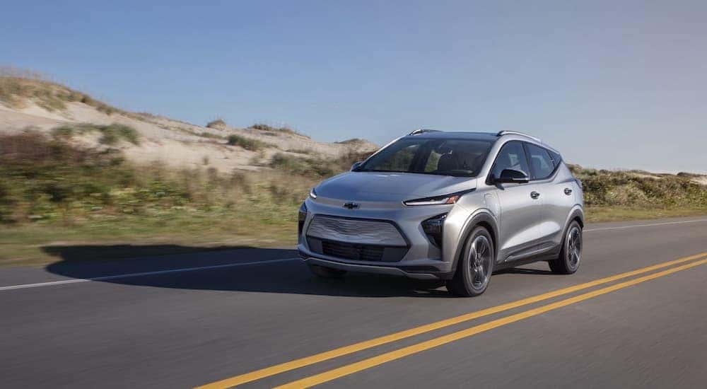 A grey 2023 Chevy Bolt EUV is shown from the front at an angle after the owner looked for a Chevy Bolt for sale.