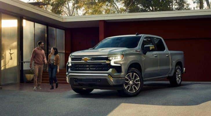 A silver 2022 Chevy Silverado 1500 Z71 is shown parked in a driveway.