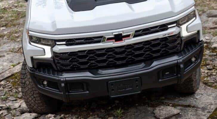 A close up of the front of a white 2023 Chevy Silverado ZR2 Bison for sale is shown near Middletown, PA.