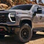 A grey 2024 Chevy Silverado 2500 HD ZR2 is shown from the front at an angle.