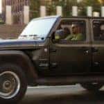 Black 2022 Jeep Wrangler Driver Side Exterior on Road