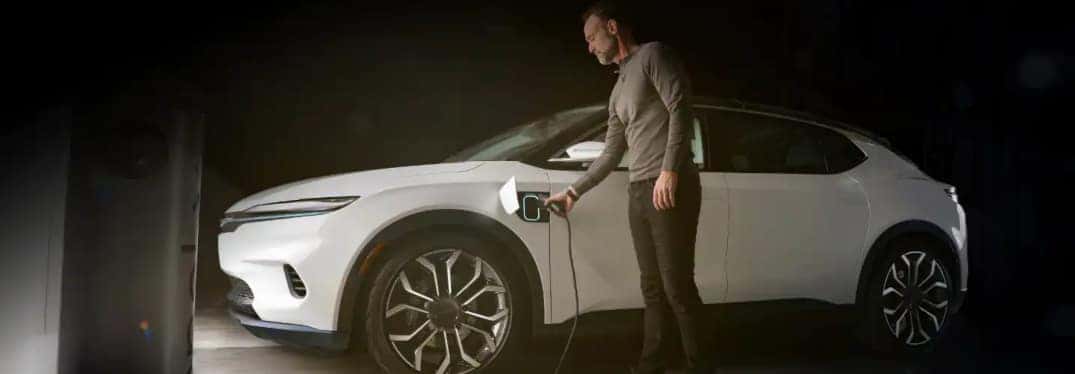 Man Charging Chrysler Airflow Concept EV