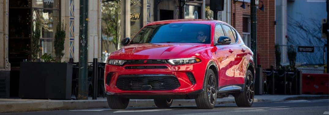 red dodge hornet on the street