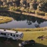 fifth wheel trailer by lake