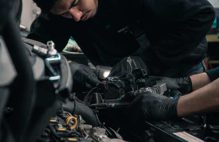 mechanics working on engine