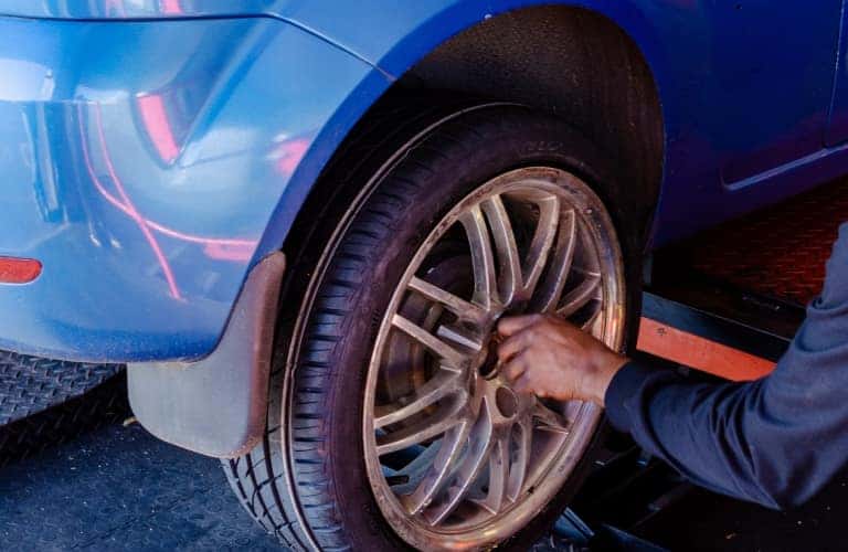 tire change on blue vehicle