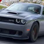 front of gray challenger srt hellcat