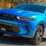 blue dodge hornet on the road