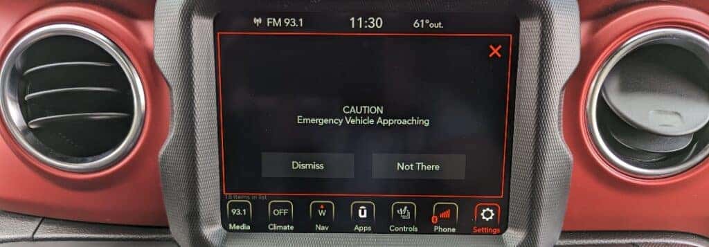 EMergency Vehicle Alert System stating "Caution Emergency Vehicle Approaching" on Uconnect Touchscreen