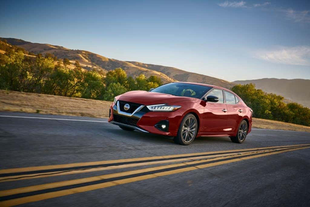 2021 Nissan Maxima red at speed mountain highway