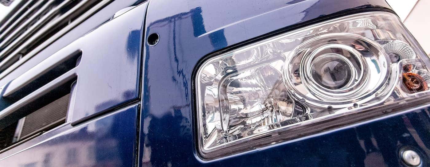 https://di-uploads-pod21.dealerinspire.com/rechtieninternationaltrucks/uploads/2019/08/semi-truck-headlights-close-up.jpg