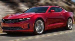 A red 2020 Chevy Camaro is facing left.