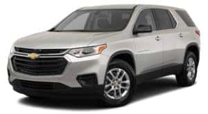 A silver 2020 Chevy Traverse is facing left.