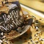 A gold Happy New Year's hat is shown.