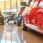 A close up of used cars parked in a showroom at a local used car dealership near Atlanta, GA.