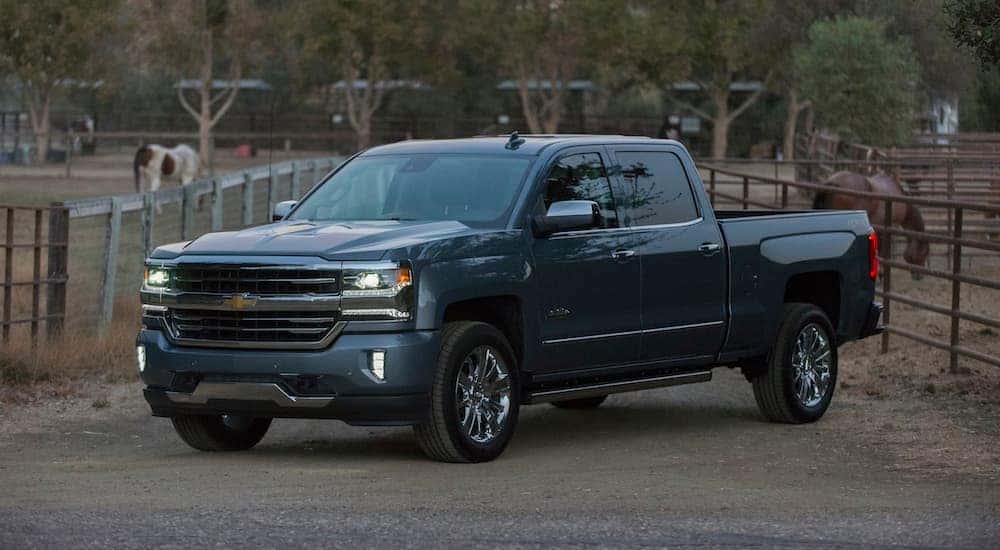 A blue 2018 used Chevrolet Silverado 1500 is parked at a farm near Buford, GA.