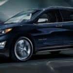 A blue 2020 Chevy Equinox is driving through a dark lit tunnel near Atlanta, GA.
