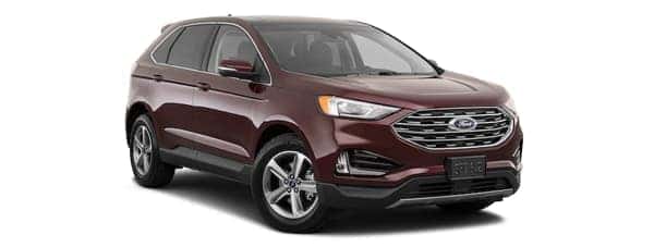 A burgundy 2020 Ford Edge is facing right.