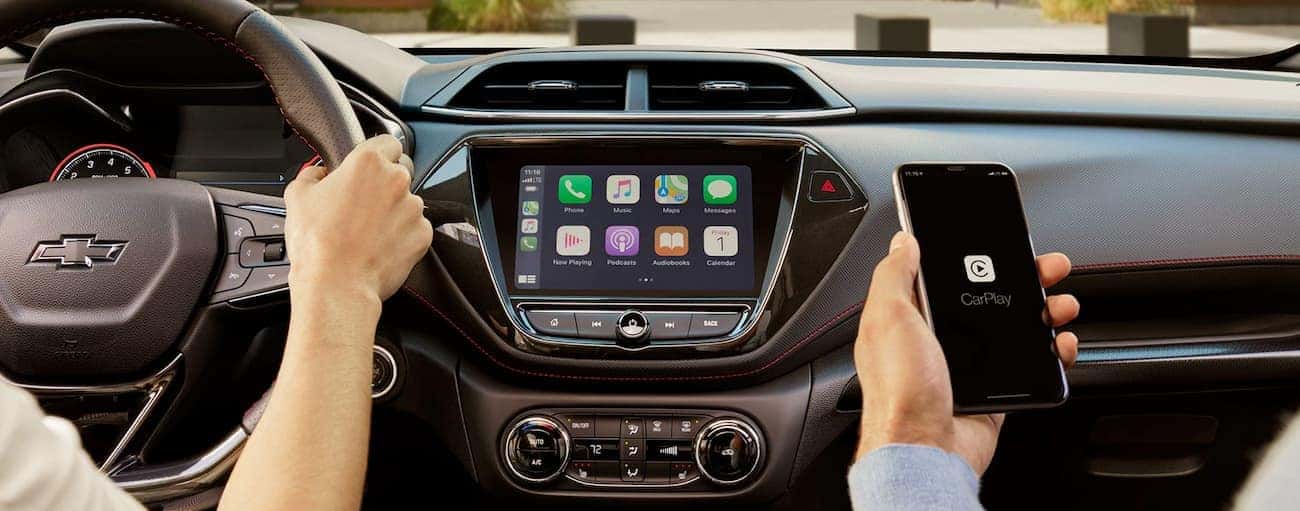 A phone is being used with the infotainment system in the 2021 Chevy Trailblazer.
