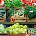 A stand with fresh vegetables in Atlanta, GA, is shown.
