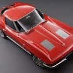 A red 1963 Chevy Corvette Coupe is shown on a grey background.