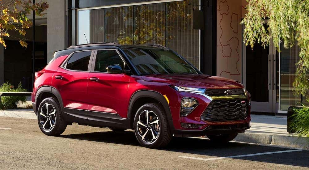 A red 2021 Chevy Trailblazer is parked on a city street.