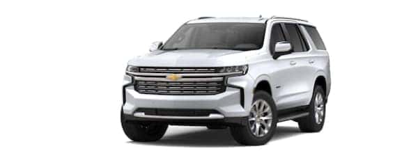 A white 2021 Chevy Tahoe is facing left.