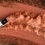 A white 2017 Chevy Colorado ZR2 is shown from above kicking up dirt on a track.