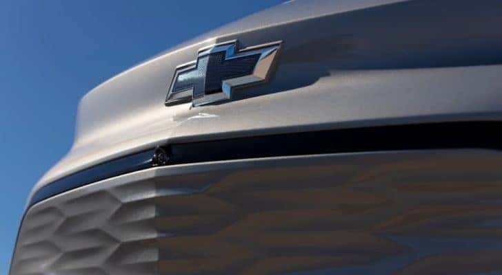 The front end of a 2022 Chevy Bolt EUV, a new Chevy EV, is shown in closeup.