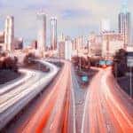 Blurred car lights are on the highway in Atlanta, GA.