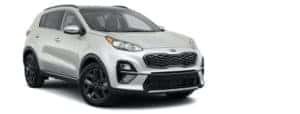 A white 2021 Kia Sportage is angled right.