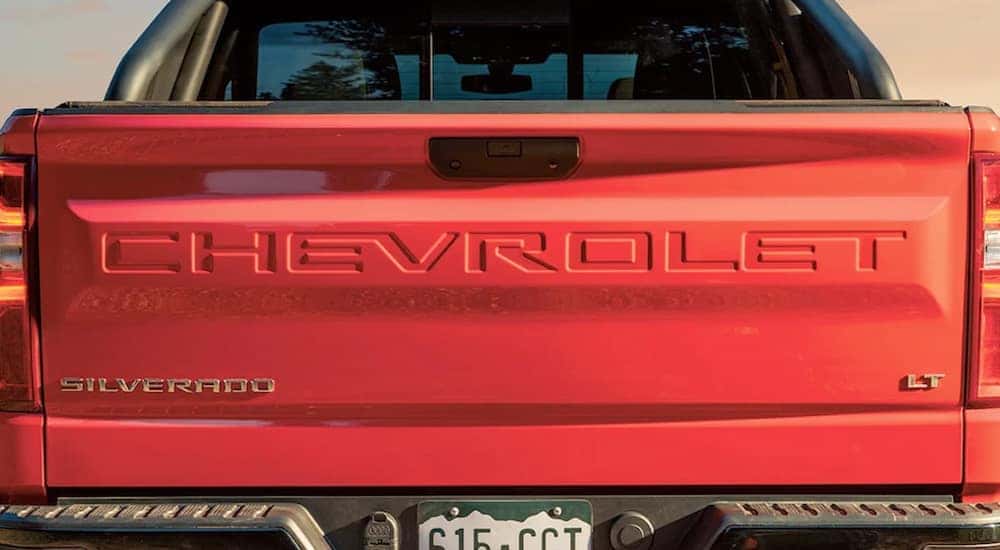 A red 2020 Chevy Silverado 1500 shows the lift-gate.