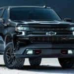 A black 2021 Chevy Silverado is parked on salt flats.
