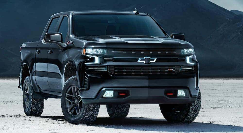 A black 2021 Chevy Silverado is parked on salt flats.