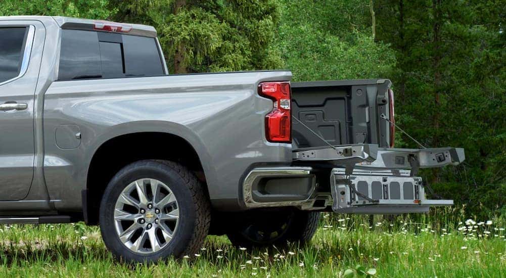 The Multi-Flex tailgate is shown in use on a grey 2021 Chevy Silverado from a Chevy Silverado 1500 dealer.