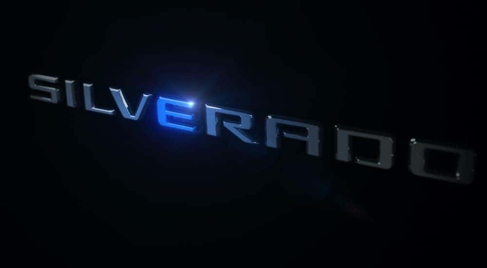 A black image shows the Silverado emblem illuminated.