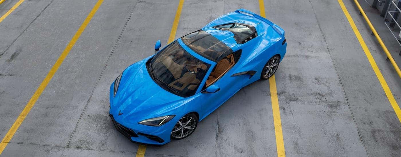 A blue 2022 Chevy Corvette C8 is shown from above.
