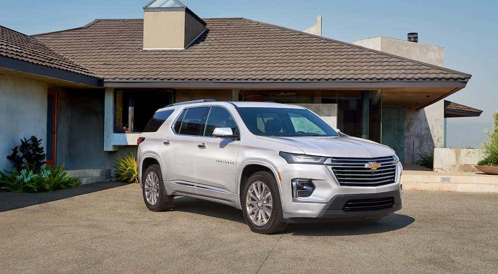 A silver 2022 Chevy Traverse is shown parked in a driveway.